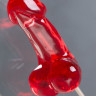 Красный леденец в форме фаллоса со вкусом виски