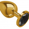 Золотистая большая анальная пробка с чёрным кристаллом - 9,5 см.