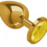Золотистая большая анальная пробка с желтым кристаллом - 9,5 см.