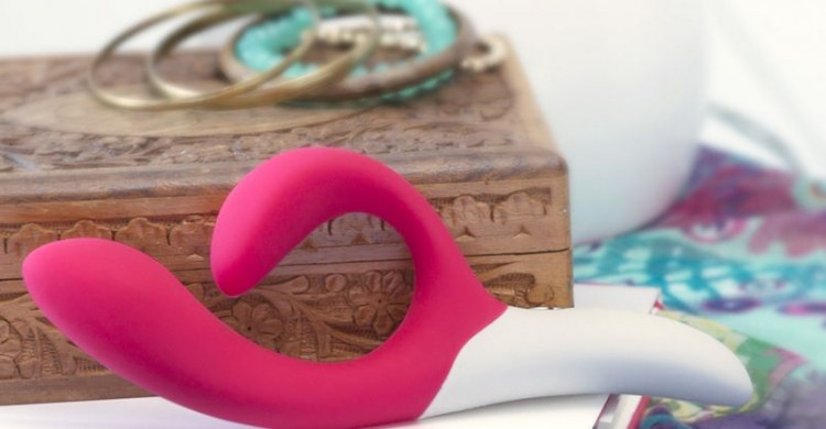 Розовый вибромассажёр с клиторальным отростком We Vibe Nova Pink - 21,5 см.