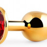 Золотистая анальная пробка с красным стразом - 7,2 см.