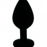 Чёрная силиконовая анальная пробка с изумрудным кристаллом - 7 см.