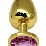 Золотистая пробка с розовым кристаллом - 9 см.